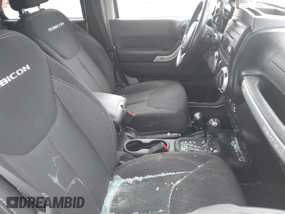 2015 Jeep Wrangler Unlimited Rubicon with VIN 1C4BJWFG1FL546018, listed as a IAAI auction lot 42060045 with 107,249 mi miles and . Bid and sale history available at DreamBid. Image 5.