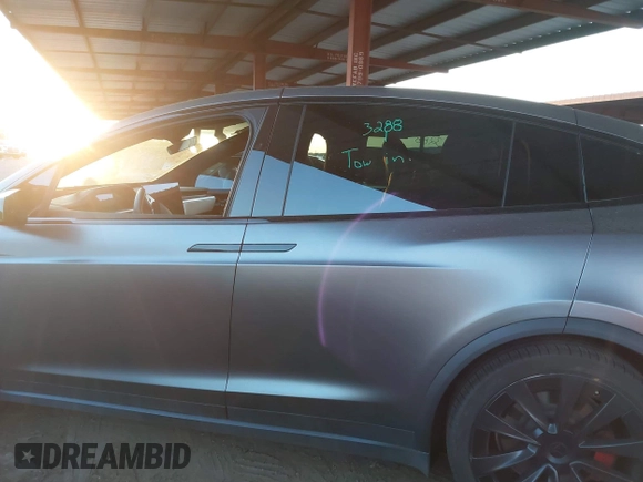 2022 Tesla Model X Plaid z VIN 7SAXCBE69NF352875, wystawiony jako IAAI lot #41964970 z przebiegiem 34 065 mil mil oraz . Historia ofert i sprzedaży dostępna na DreamBid. Obrazek 15.