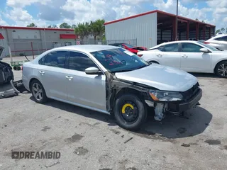 2015 Volkswagen Passat 1.8T Limited Edition with VIN 1VWAT7A35FC109653, listed as a IAAI auction lot 41917568 with 118,912 mi miles. Bid and sale history available at carsss.com. Image 1.