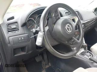 2013 Mazda CX-5 Sport with VIN JM3KE2BE1D0160254, listed as a IAAI auction lot 42256555 with 136,476 mi miles and . Bid and sale history available at DreamBid. Image 11.