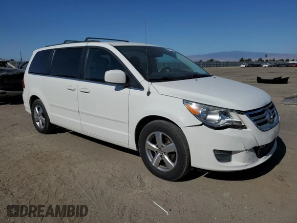 2011 Volkswagen Routan SE with VIN 2V4RW3DG5BR739944, listed as a Copart auction lot 56787495 with 84,932 mi miles and Salvage title. Bid and sale history available at DreamBid. Image 4.