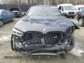 2023 BMW X4 M with VIN 5YM23EC03P9S24918, listed as a Copart auction lot 45127705 with 9,817 mi miles and Salvage Title. Bid and sale history available at carsss.com. Image 5.