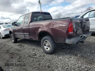 2000 Ford F-150 XL with VIN 1FTRX18WXYNB79888, listed as a Copart auction lot 46323685 with 143,904 mi miles and Salvage Title. Bid and sale history available at carsss.com. Image 2.