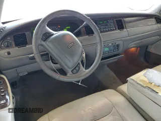 1999 Lincoln Town Car Executive with VIN 1LNHM81W2XY658371, listed as a Copart auction lot 60249045 with 191,266 mi miles and Salvage title. Bid and sale history available at DreamBid. Image 8.
