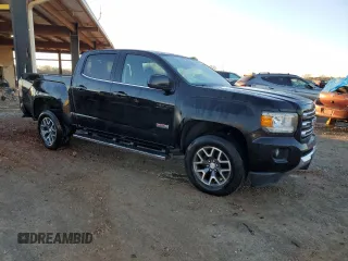 2016 GMC Canyon 2WD SLE with VIN 1GTG5CE33G1386325, listed as a Copart auction lot 86988134 with 91,610 mi miles and Salvage Title. Bid and sale history available at carsss.com. Image 4.