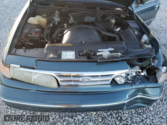1996 Ford Crown Victoria LX z VIN 2FALP74W0TX205507, wystawiony jako Copart lot #85310874 z przebiegiem 51 646 mil mil oraz Szkoda całkowita • Salvage title. Historia ofert i sprzedaży dostępna na DreamBid. Obrazek 11.