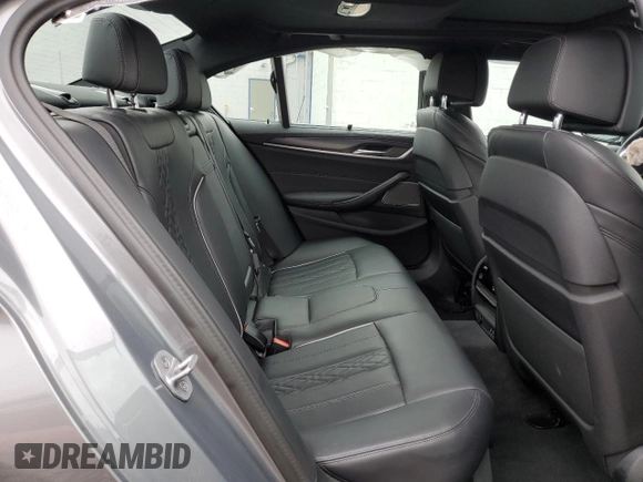 2023 BMW 5 Series M550i xDrive with VIN WBA13BK06PCN02733, listed as a Copart auction lot 48767235 with 27,725 mi miles and Salvage title. Bid and sale history available at DreamBid. Image 10.