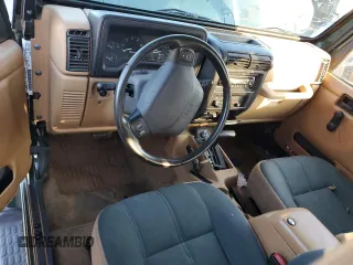 1998 Jeep Wrangler Sahara z VIN 1J4FY49S5WP798505, wystawiony jako Copart lot #88394465 z przebiegiem Nie podano mil oraz Szkoda całkowita • Salvage title. Historia ofert i sprzedaży dostępna na DreamBid. Obrazek 8.