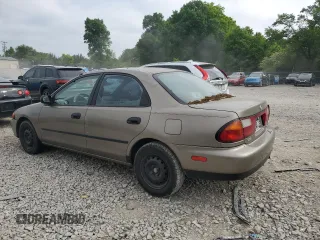 1997 Mazda Protege DX z VIN JM1BC1414V0103244, wystawiony jako Copart lot #56219745 z przebiegiem Nie podano mil oraz Szkoda całkowita • Salvage title. Historia ofert i sprzedaży dostępna na DreamBid. Obrazek 2.