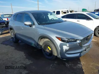 2020 Mazda CX-5 Touring with VIN JM3KFACM1L0789394, listed as a IAAI auction lot 41565887 with 73,730 mi miles. Bid and sale history available at carsss.com. Image 1.