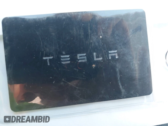 2021 Tesla Model Y Standard Range z VIN 5YJYGDED4MF123311, wystawiony jako IAAI lot #41200519 z przebiegiem 70 190 mil mil oraz . Historia ofert i sprzedaży dostępna na DreamBid. Obrazek 11.