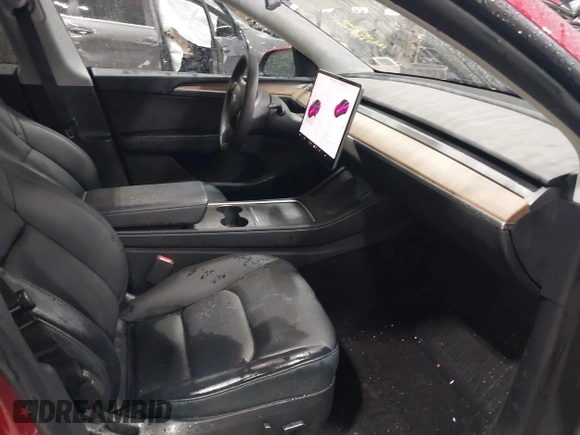 2024 Tesla Model Y Long Range with VIN 7SAYGAEE2RF986206, listed as a IAAI auction lot 42177852 with 14,399 mi miles and . Bid and sale history available at DreamBid. Image 5.
