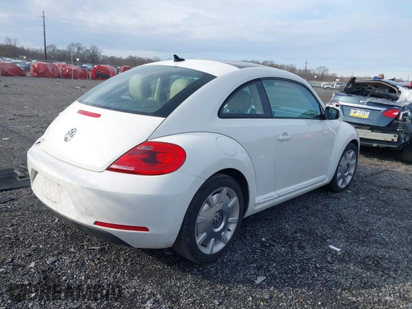 2014 Volkswagen Beetle 2.5L w/Sun with VIN 3VWJP7AT8EM611560, listed as a IAAI auction lot 41488488 with 140,798 mi miles and . Bid and sale history available at DreamBid. Image 4.