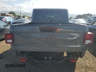 2023 Jeep Gladiator Rubicon with VIN 1C6JJTBG8PL550219, listed as a Copart auction lot 54627685 with 9,671 mi miles and Salvage title. Bid and sale history available at DreamBid. Image 6.