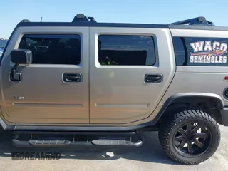 2003 Hummer H2 with VIN 5GRGN23U43H125114, listed as a IAAI auction lot 42160986 with 157,776 mi miles. Bid and sale history available at carsss.com. Image 14.