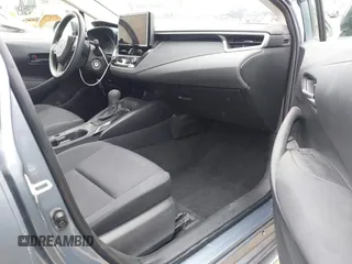 2023 Toyota Corolla Hybrid LE with VIN JTDBCMFE8PJ013271, listed as a IAAI auction lot 42099797 with 14,080 mi miles and . Bid and sale history available at carsss.com. Image 5.