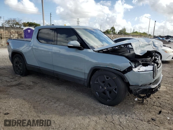 2023 Rivian R1T Adventure with VIN 7FCTGBAA2PN028983, listed as a Copart auction lot 45307015 with 220 mi miles and Salvage Title. Bid and sale history available at DreamBid. Image 4.