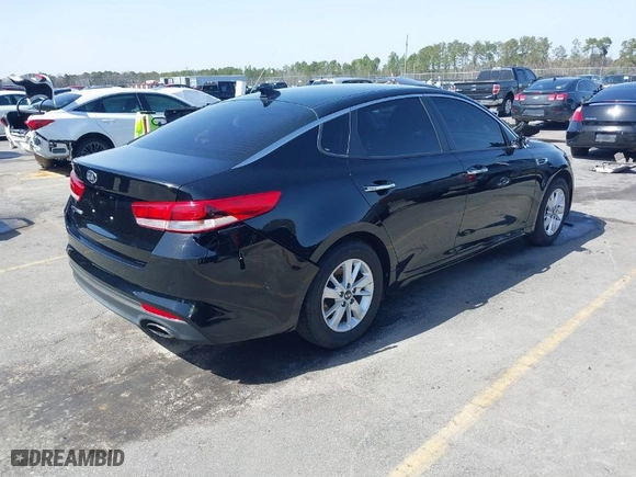 2018 Kia Optima S with VIN 5XXGT4L36JG221671, listed as a IAAI auction lot 41704040 with 136,815 mi miles. Bid and sale history available at carsss.com. Image 4.