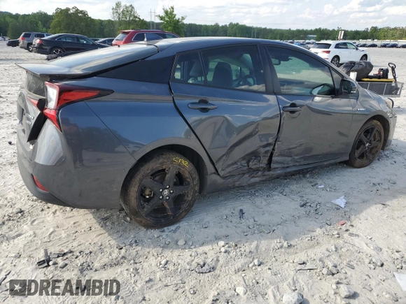 2022 Toyota Prius L Eco z VIN JTDKAMFU8N3173133, wystawiony jako Copart lot #54865615 z przebiegiem 100 876 mil mil oraz Szkoda całkowita • Salvage title. Historia ofert i sprzedaży dostępna na DreamBid. Obrazek 3.