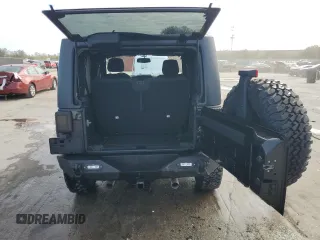 2017 Jeep Wrangler Willys Wheeler with VIN 1C4AJWAG1HL624254, listed as a Copart auction lot 42678975 with 51,936 mi miles and Salvage Title. Bid and sale history available at DreamBid. Image 6.