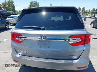 2018 Honda Odyssey Touring with VIN 5FNRL6H81JB022975, listed as a IAAI auction lot 42653304 with 210,137 mi miles and . Bid and sale history available at DreamBid. Image 17.