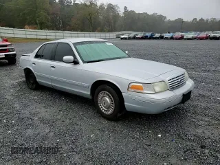 1999 Ford Crown Victoria Police z VIN 2FAFP71W8XX237354, wystawiony jako Copart lot #79340304 z przebiegiem 198 482 mil mil oraz Szkody całkowita. Historia ofert i sprzedaży dostępna na DreamBid. Obrazek 11.