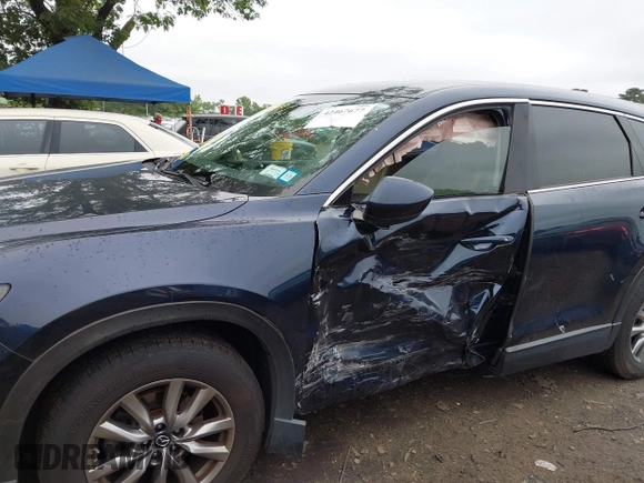2019 Mazda CX-9 Touring with VIN JM3TCBCY6K0334898, listed as a IAAI auction lot 42467677 with 69,454 mi miles and . Bid and sale history available at DreamBid. Image 6.