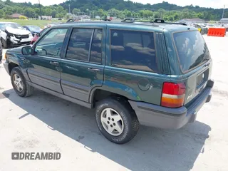 1995 Jeep Grand Cherokee Laredo with VIN 1J4FX58S0SC716398, listed as a IAAI auction lot 42647346 with 58,184 mi miles and . Bid and sale history available at DreamBid. Image 3.