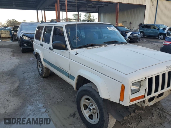 1999 Jeep Cherokee Sport with VIN 1J4FT68S6XL578679, listed as a Copart auction lot 76697394 with 196,110 mi miles and Salvage title. Bid and sale history available at DreamBid. Image 4.