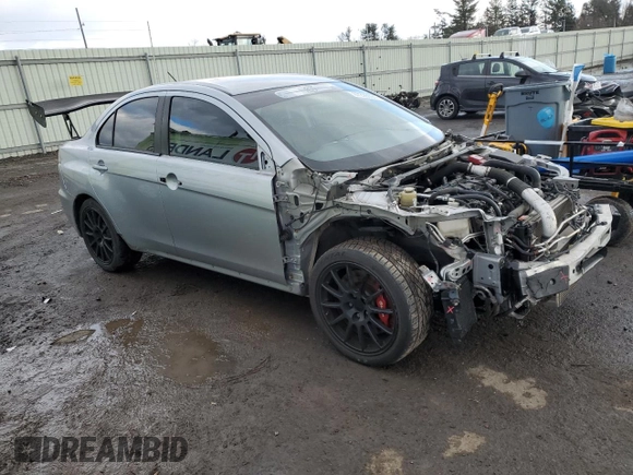 2014 Mitsubishi Lancer Evolution GSR z VIN JA32W8FVXEU000210, wystawiony jako Copart lot #87228694 z przebiegiem 120 356 mil mil oraz Szkody całkowita. Historia ofert i sprzedaży dostępna na DreamBid. Obrazek 4.