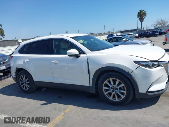 2019 Mazda CX-9 Touring with VIN JM3TCACY5K0306424, listed as a IAAI auction lot 42150466 with 95,166 mi miles and . Bid and sale history available at DreamBid. Image 13.