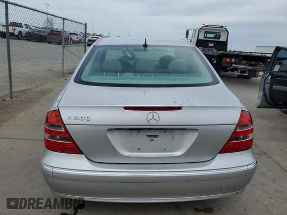 2003 Mercedes-Benz E-Class 5.0L with VIN WDBUF70J03A112909, listed as a Copart auction lot 49924865 with 158,244 mi miles and Salvage Title. Bid and sale history available at carsss.com. Image 6.