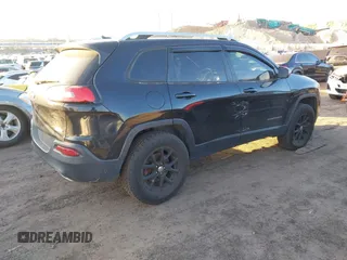 2015 Jeep Cherokee Latitude with VIN 1C4PJMCS0FW745949, listed as a IAAI auction lot 41289847 with 137,440 mi miles and . Bid and sale history available at carsss.com. Image 4.