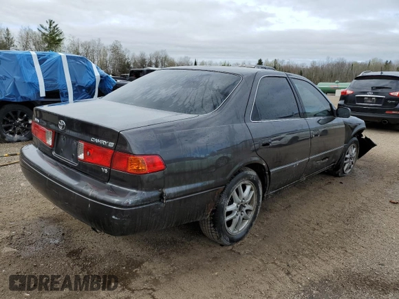 2001 Toyota Camry LE z VIN JT2BF22K010295564, wystawiony jako Copart lot #55111755 z przebiegiem 379 337 mil mil oraz Szkoda całkowita • Salvage title. Historia ofert i sprzedaży dostępna na DreamBid. Obrazek 3.