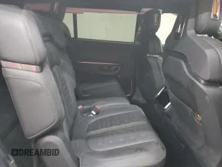 2023 Rivian R1S Adventure z VIN 7PDSGABA2PN013659, wystawiony jako Copart lot #53475945 z przebiegiem 13 928 mil mil oraz Szkody całkowita. Historia ofert i sprzedaży dostępna na DreamBid. Obrazek 12.