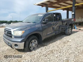 2010 Toyota Tundra with VIN 5TFRM5F15AX017328, listed as a Copart auction lot 63371895 with 123,272 mi miles and Salvage title. Bid and sale history available at DreamBid. Image 1.