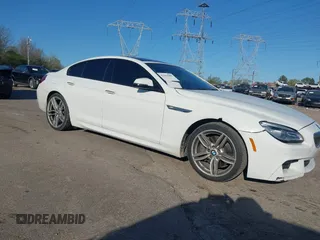2016 BMW 6 Series 640i xDrive with VIN WBA6D2C51GGT66209, listed as a IAAI auction lot 42064405 with 113,500 mi miles and . Bid and sale history available at carsss.com. Image 1.