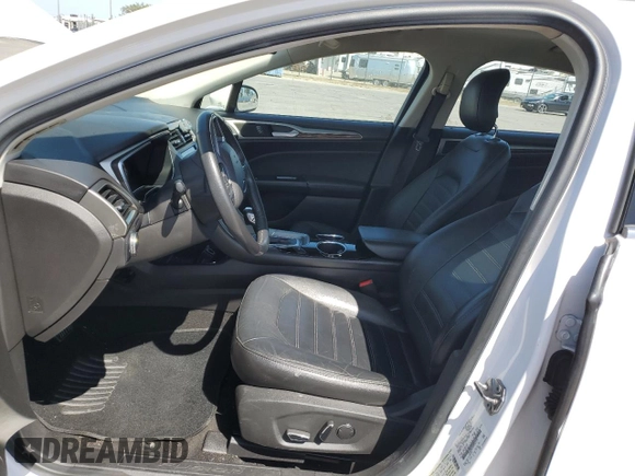 2013 Ford Fusion SE Hybrid z VIN 3FA6P0LU6DR325719, wystawiony jako Copart lot #55777715 z przebiegiem 152 478 mil mil oraz Szkoda całkowita • Salvage title. Historia ofert i sprzedaży dostępna na DreamBid. Obrazek 7.