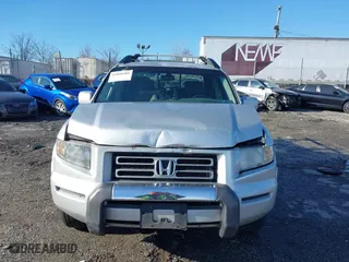 2006 Honda Ridgeline RTL with VIN 2HJYK165X6H570027, listed as a IAAI auction lot 41868389 with 207,020 mi miles. Bid and sale history available at carsss.com. Image 12.