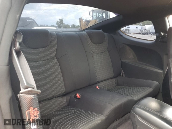 2013 Hyundai Genesis Coupe Premium z VIN KMHHT6KD3DU086928, wystawiony jako Copart lot #55731185 z przebiegiem 101 092 mil mil oraz Szkody całkowita. Historia ofert i sprzedaży dostępna na DreamBid. Obrazek 10.
