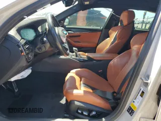 2020 BMW M5 z VIN WBSJF0C09LCE53241, wystawiony jako Copart lot #52607075 z przebiegiem Nie podano mil oraz Szkoda całkowita • Salvage title. Historia ofert i sprzedaży dostępna na DreamBid. Obrazek 7.