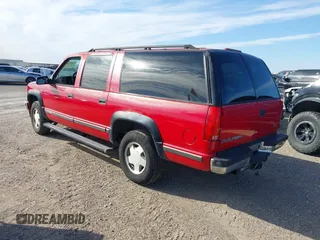 1999 GMC Suburban with VIN 1GKFK16RXXJ809823, listed as a IAAI auction lot 41687406 with 360,799 mi miles. Bid and sale history available at carsss.com. Image 3.