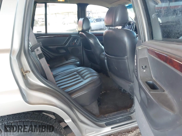 2000 Jeep Grand Cherokee Limited z VIN 1J4GW58N1YC206992, wystawiony jako IAAI lot #42057236 z przebiegiem 183 986 mil mil oraz . Historia ofert i sprzedaży dostępna na DreamBid. Obrazek 8.