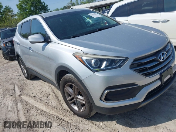 2018 Hyundai Santa Fe 2.4L z VIN 5XYZTDLB9JG513584, wystawiony jako IAAI lot #42031291 z przebiegiem 131 109 mil mil oraz . Historia ofert i sprzedaży dostępna na DreamBid. Obrazek 1.
