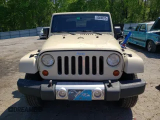 2011 Jeep Wrangler Sahara z VIN 1J4AA5D10BL528862, wystawiony jako Copart lot #53488515 z przebiegiem 198 865 mil mil oraz Szkoda całkowita • Salvage title. Historia ofert i sprzedaży dostępna na DreamBid. Obrazek 5.