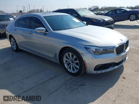 2016 BMW 7 Series 740i with VIN WBA7E2C5XGG739099, listed as a IAAI auction lot 41526038 with 123,900 mi miles. Bid and sale history available at carsss.com. Image 1.
