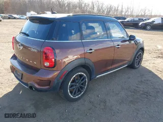 2015 MINI Cooper Countryman S with VIN WMWZC5C55FWP47826, listed as a IAAI auction lot 41342674 with 94,683 mi miles. Bid and sale history available at carsss.com. Image 4.