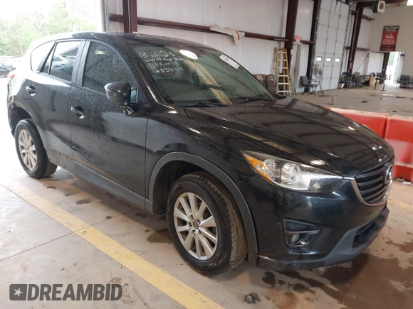 2016 Mazda CX-5 Touring with VIN JM3KE2CY7G0867355, listed as a IAAI auction lot 41963169 with 117,727 mi miles and . Bid and sale history available at DreamBid. Image 1.