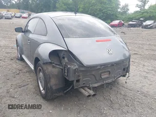 2012 Volkswagen Beetle 2.5L PZEV with VIN 3VWJP7AT2CM618436, listed as a IAAI auction lot 42297812 with 139,869 mi miles and . Bid and sale history available at DreamBid. Image 3.