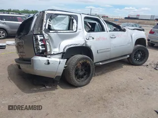 2014 Chevrolet Tahoe LT with VIN 1GNSKBE02ER147079, listed as a IAAI auction lot 42204312 with Not provided miles and . Bid and sale history available at DreamBid. Image 4.